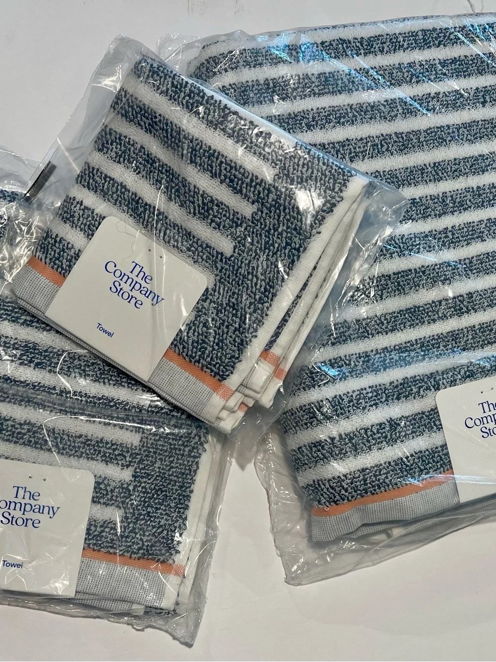 The Company Store 4 piece Navy & White Striped Towel set with Peach Accent
